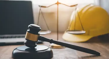 construction-law-concept-with-gavel-and-hardhat-2026-03-19-04-22-52-utc 1