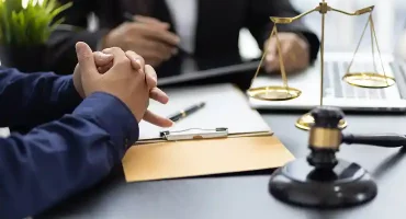 legal-professionals-discussing-agreement-in-modern-2026-01-09-00-56-56-utc 1